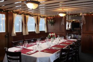 Table set for Seattle dinner cruise aboard yacht